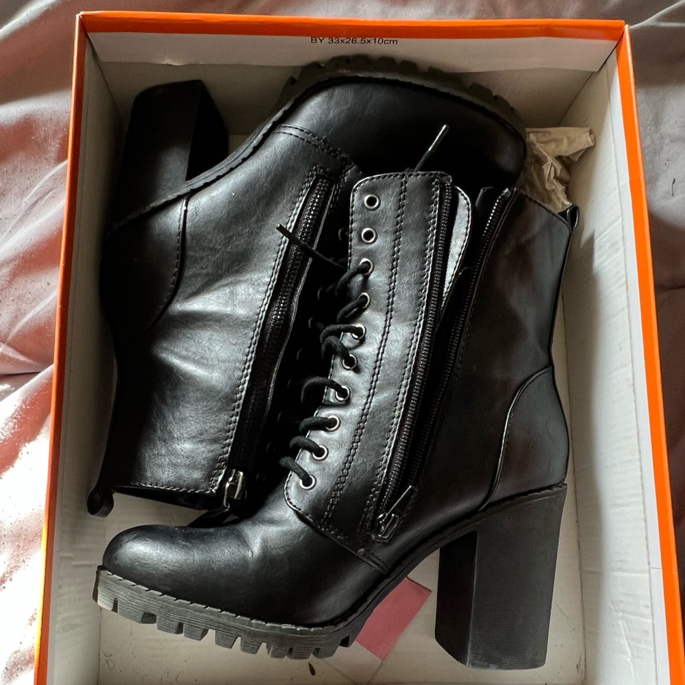 Black combat heeled boots
